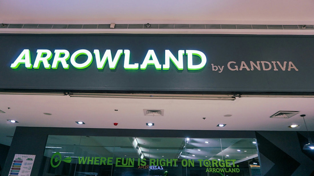 Arrowland by Gandiva illuminated signage at mall entrance